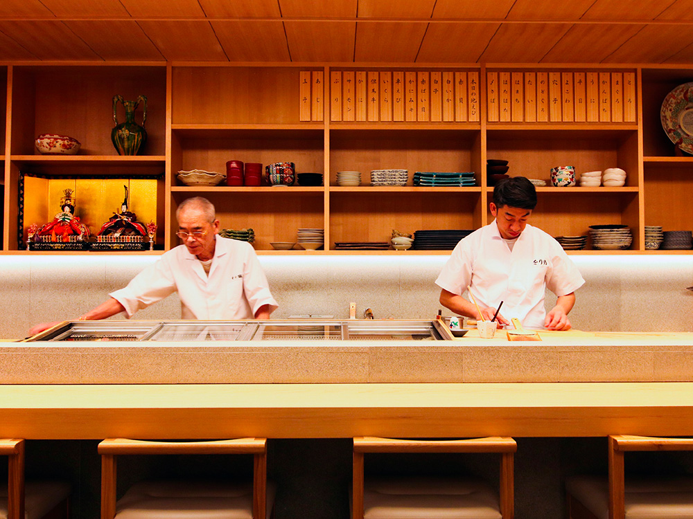 The chefs of Orizuru sushi restaurant preparing for guests.