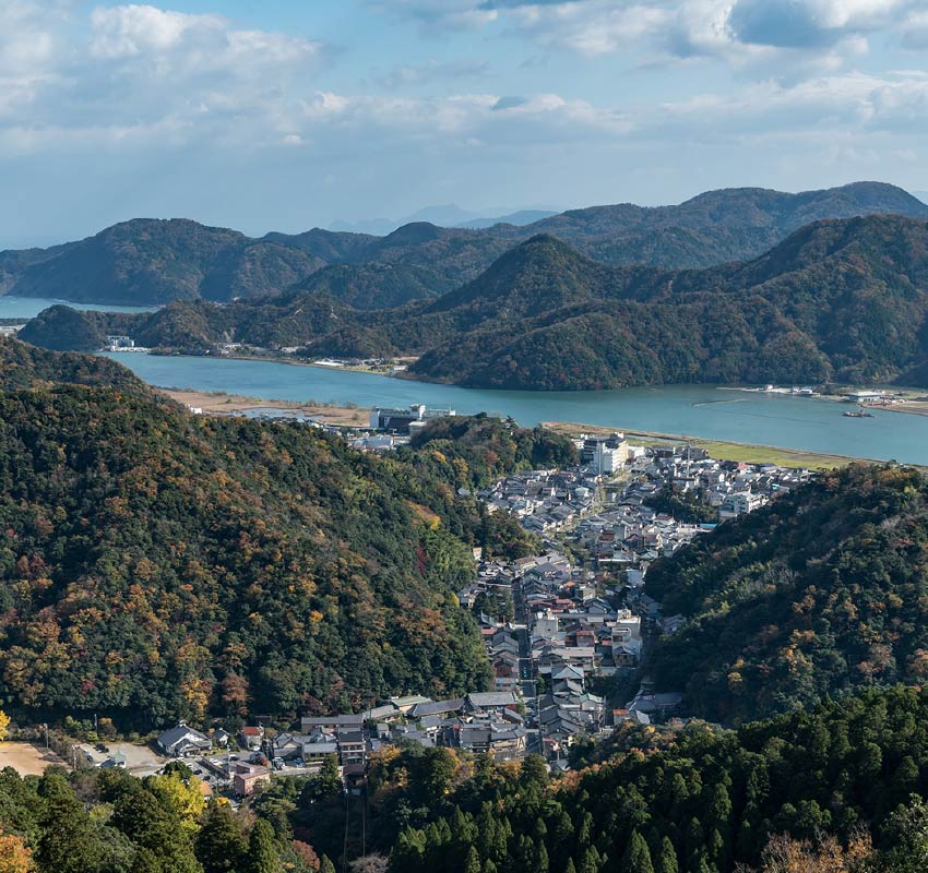 Kinosaki Onsen town and valley it sits in, taken from Mount Daishi on a sunny day