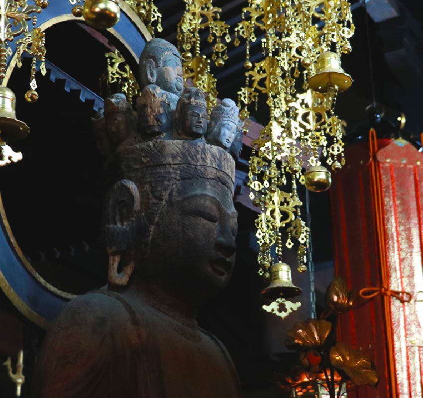 A closeup of a buddhist statue found inside Onsenji Temple