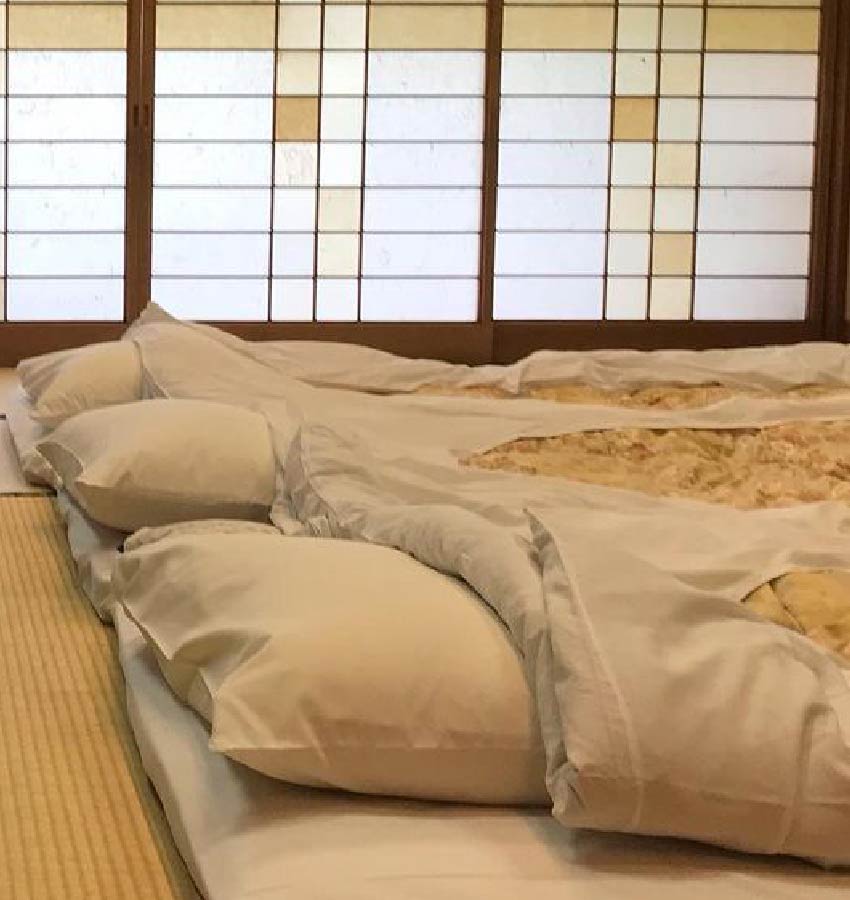 3 futons in a row on tatami floor