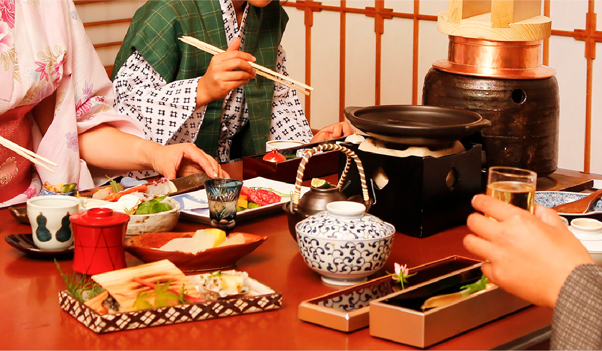 A family of three eating a kaiseki set-course dinner
